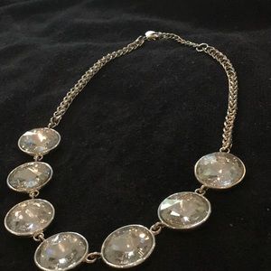 Silver crystal like embossed necklace.